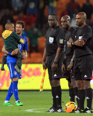 Illustration for article titled Cutest Kid Ever Invades Soccer Pitch, Gets Carried Around By Players